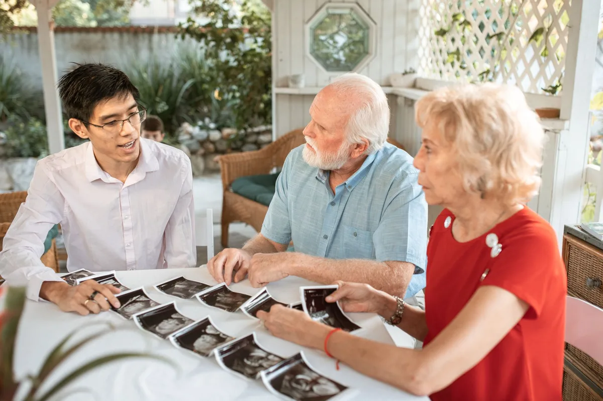 Family gathered together discussing home purchase plans