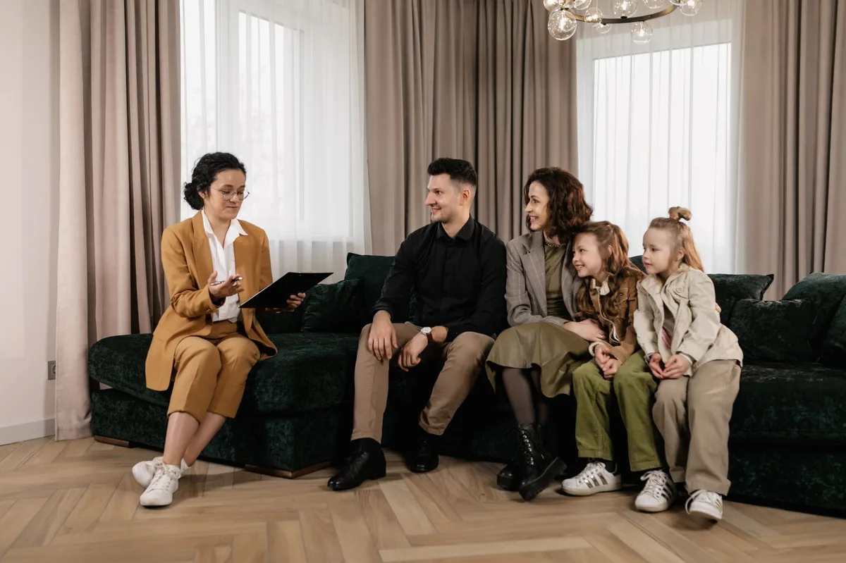 Family sitting together at home discussing financial planning