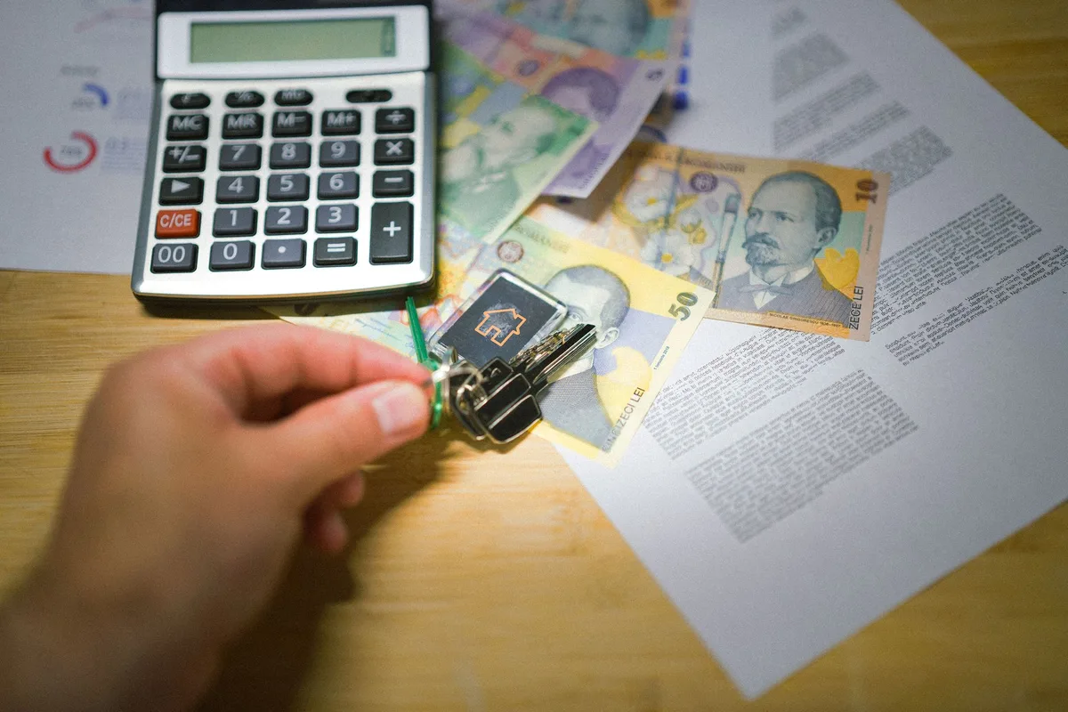 Calculator on mortgage documents showing repayment calculations