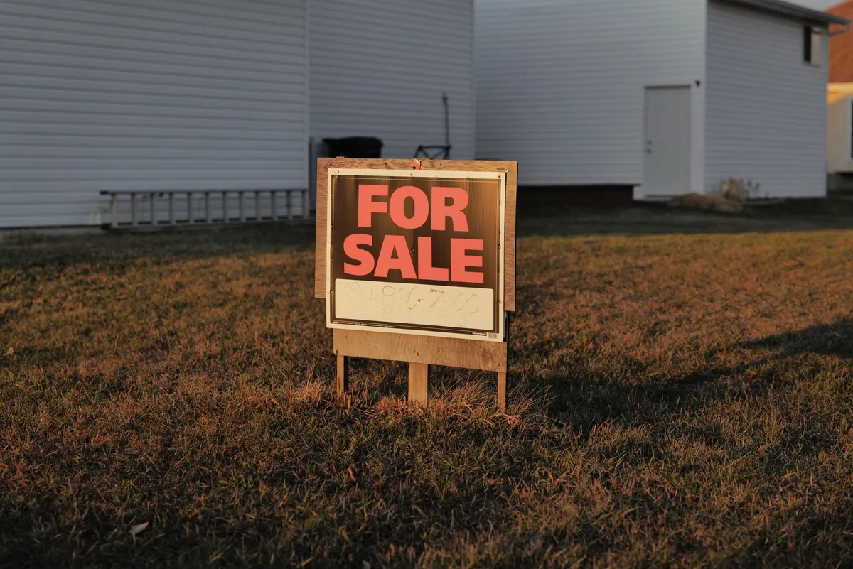 Residential property with for-sale sign representing Australian investment property