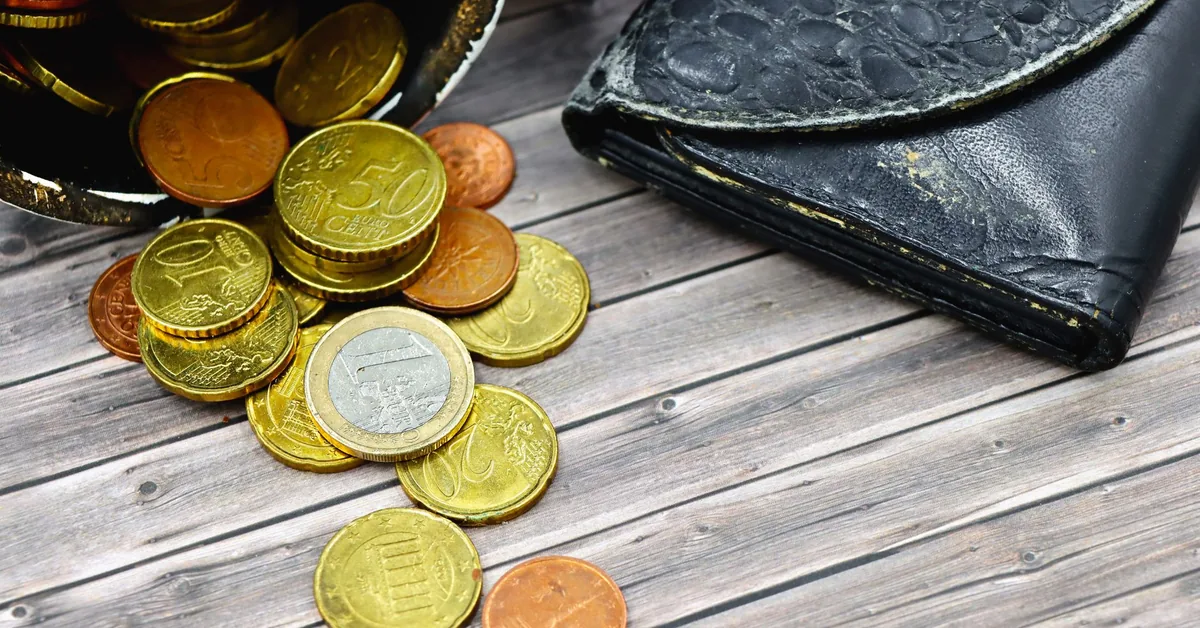 A piggy bank with coins, symbolising the financial stress of balancing mortgage repayments and essential healthcare costs in Australia.