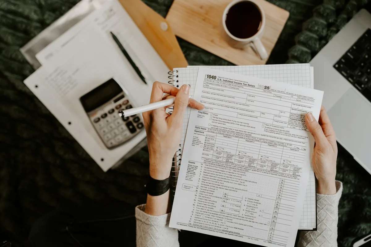 Tax documents and pen on desk for property deduction preparation