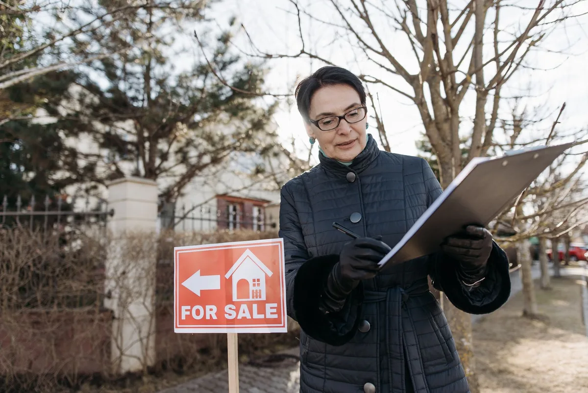 Property for sale in Australian suburb with real estate signage