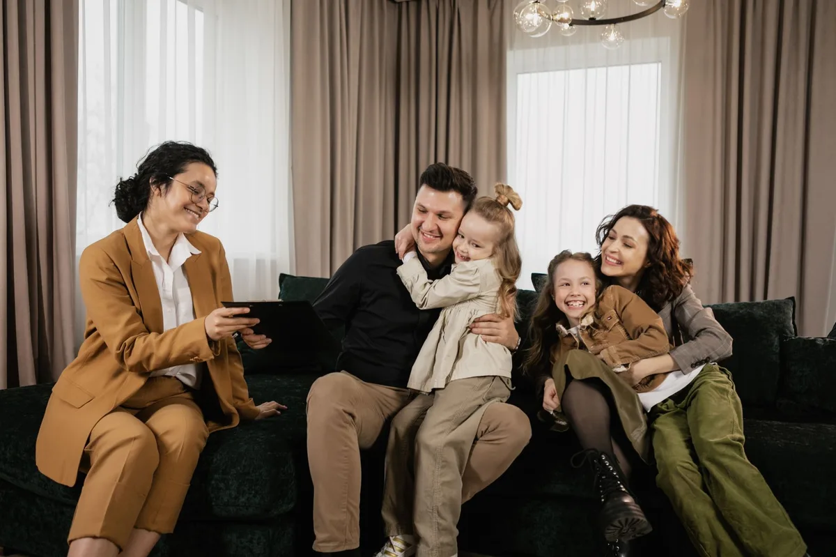 Family sitting together discussing home buying plans