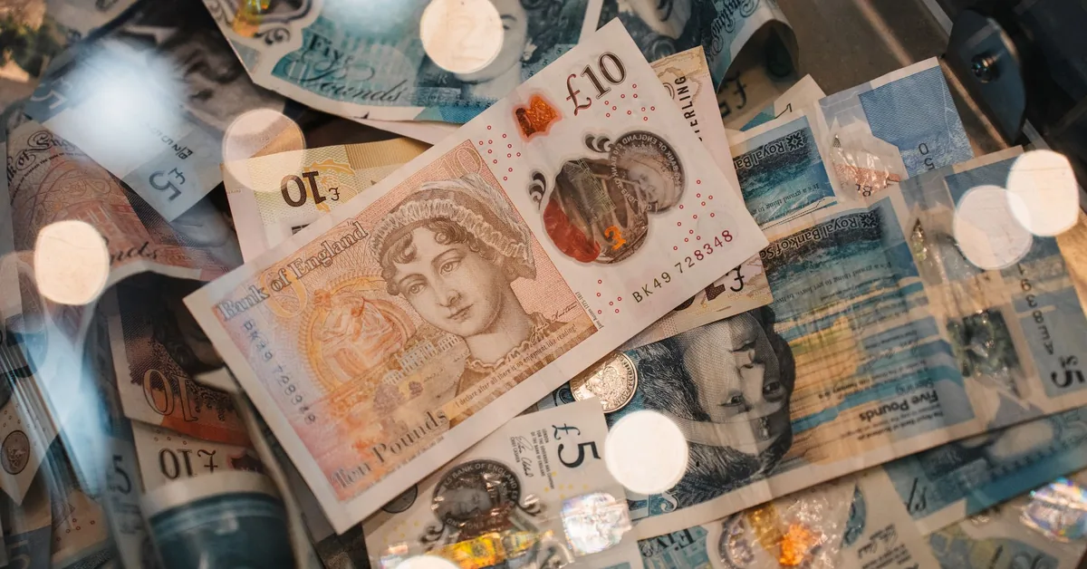 Calculator, coins and paperwork used for mortgage rate calculations