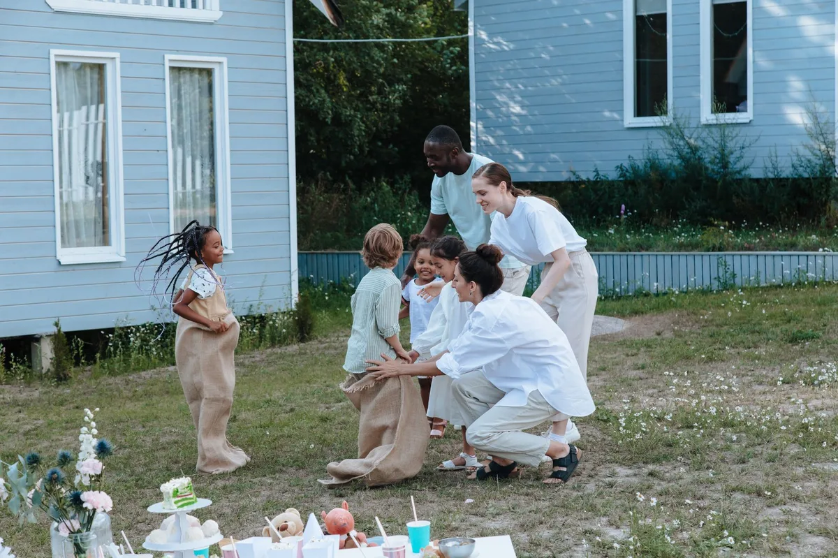 Family standing together in front of their home