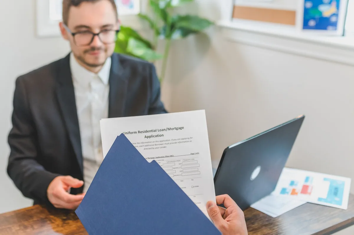 Refinance documents and paperwork on a desk