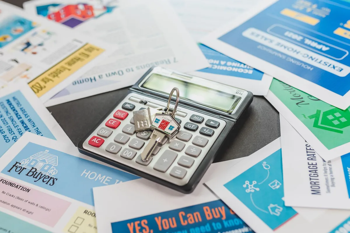 Calculator on mortgage documents showing home equity calculations